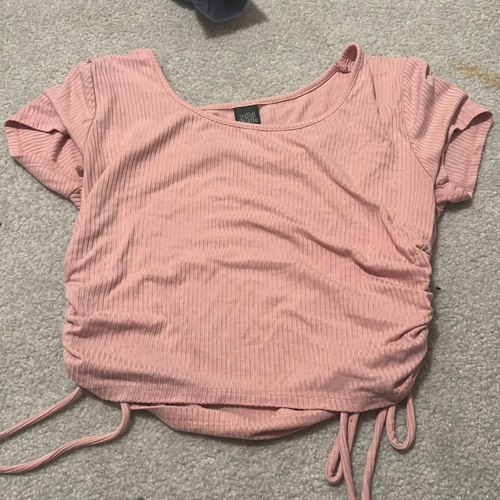 pink tight T-shirt with cinching on the sides